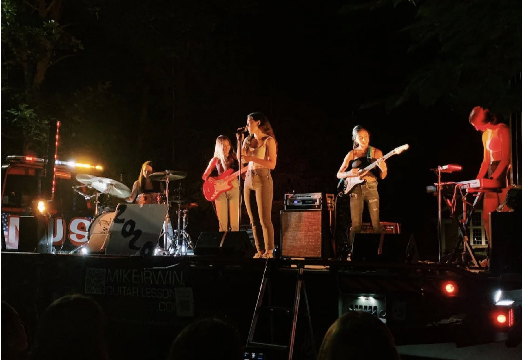Band performing onstage for Fun Facts.