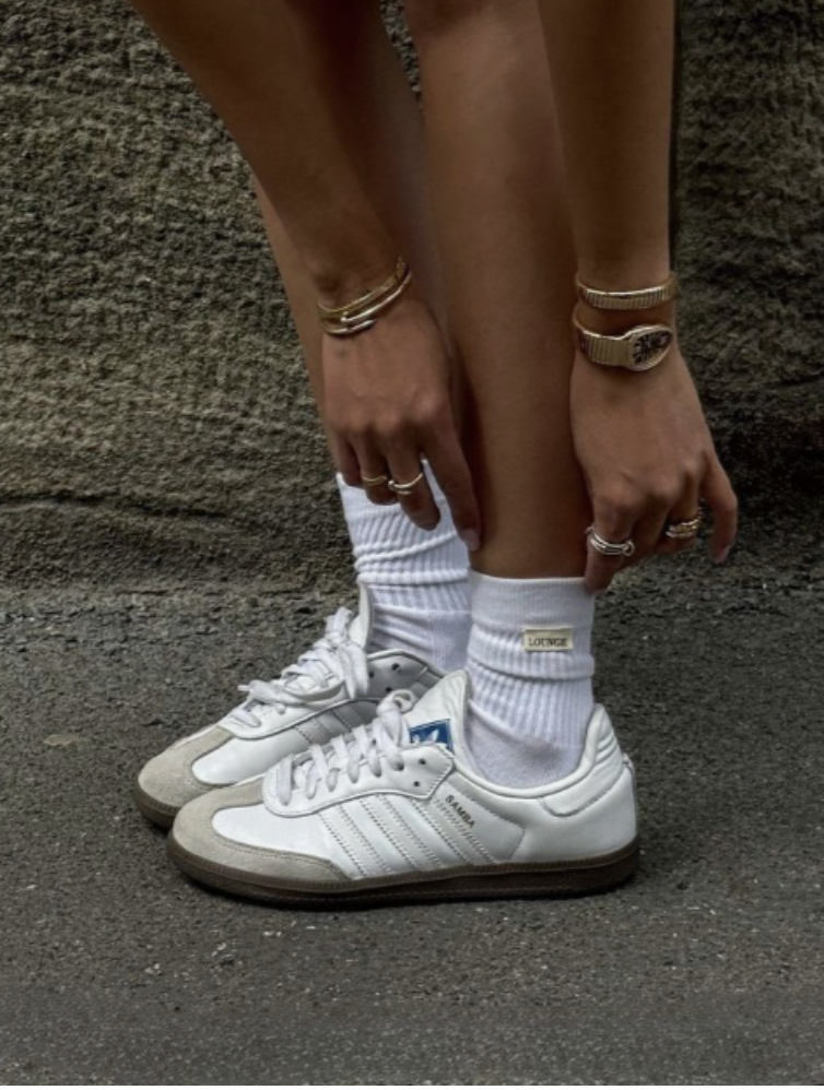 Photograph of white sneakers for The Shoes We Outgrow.